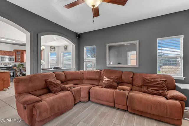 a living room with furniture and a large window