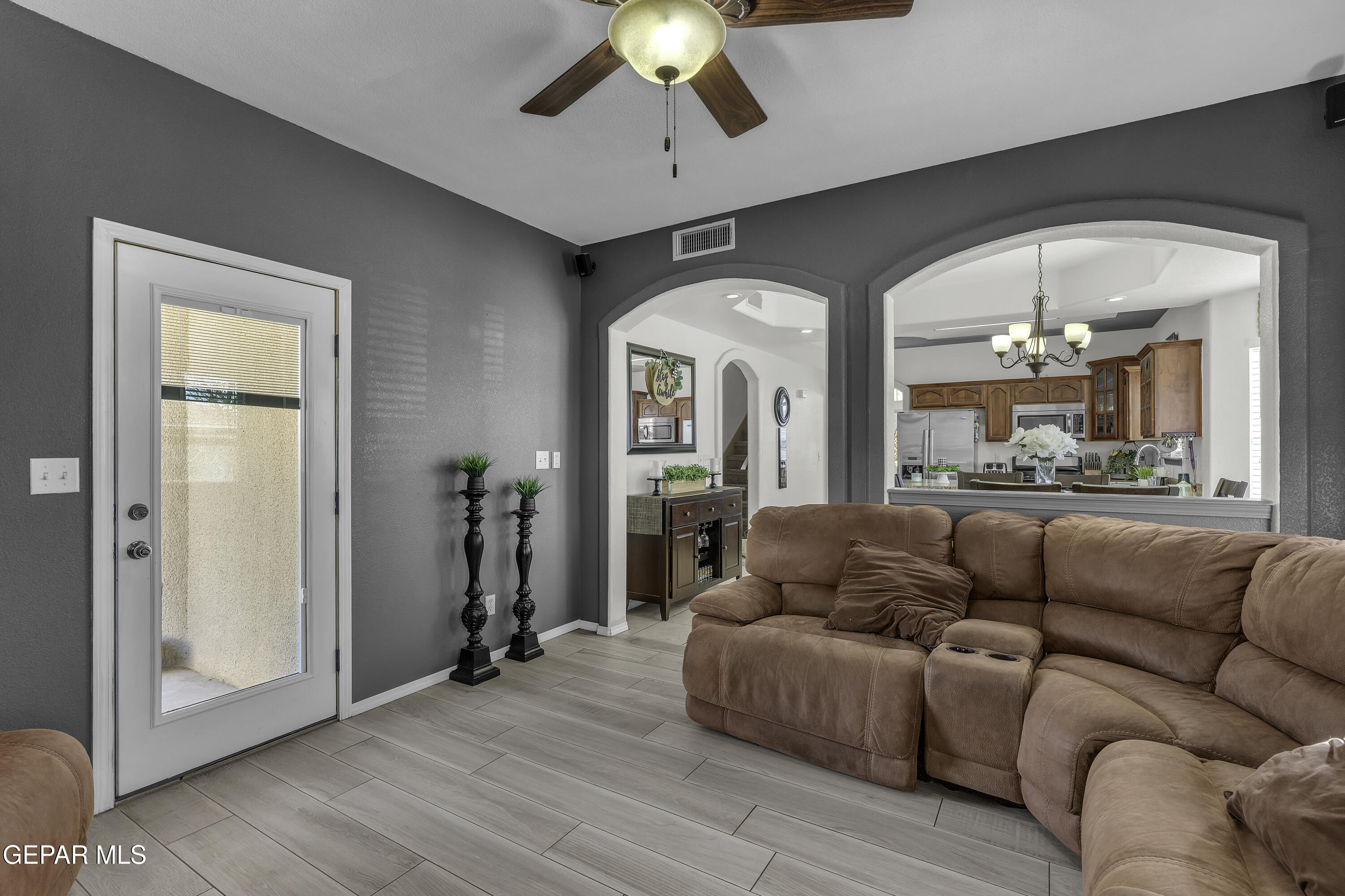 14401 Delta Point Court El Paso, TX 79938 - Photo 8 of 49 a living room with furniture and a chandelier