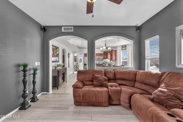 a living room with furniture and a window
