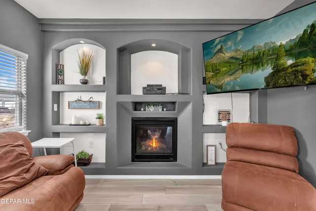 a living room with furniture fireplace and garden view