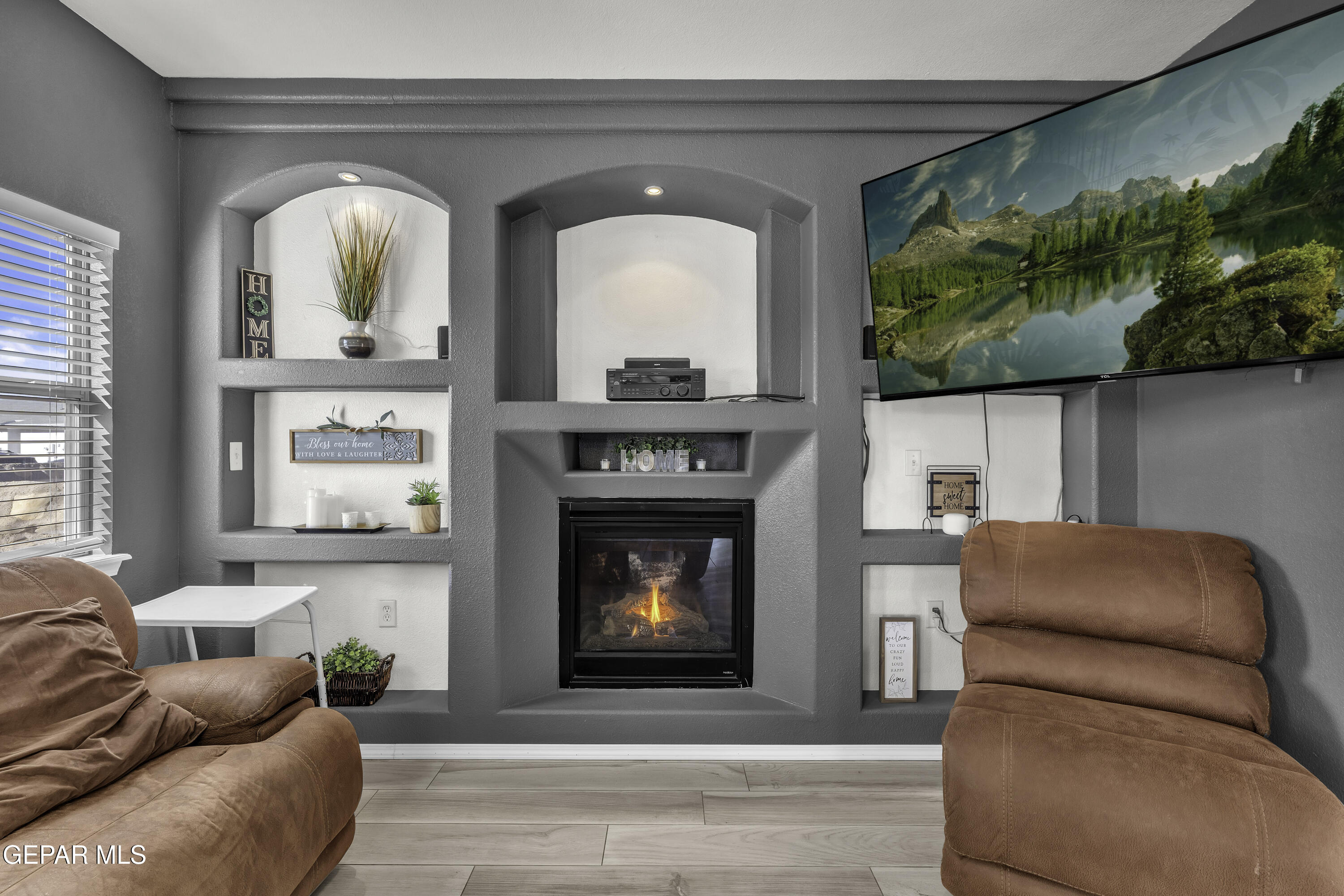 14401 Delta Point Court El Paso, TX 79938 - Photo 10 of 49 a living room with furniture fireplace and garden view