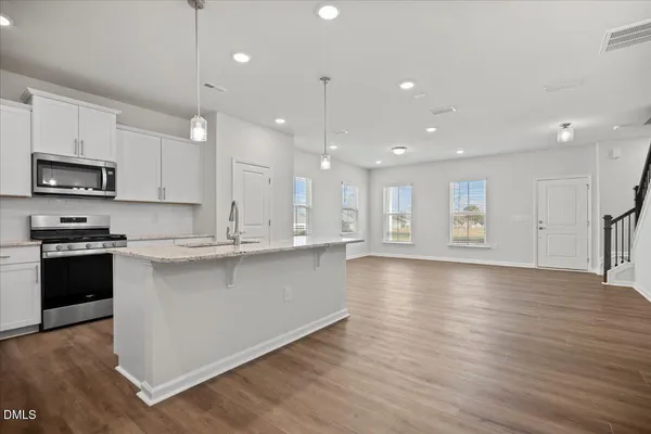 a view of kitchen view wooden floor and window