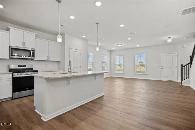 a view of kitchen view wooden floor and window