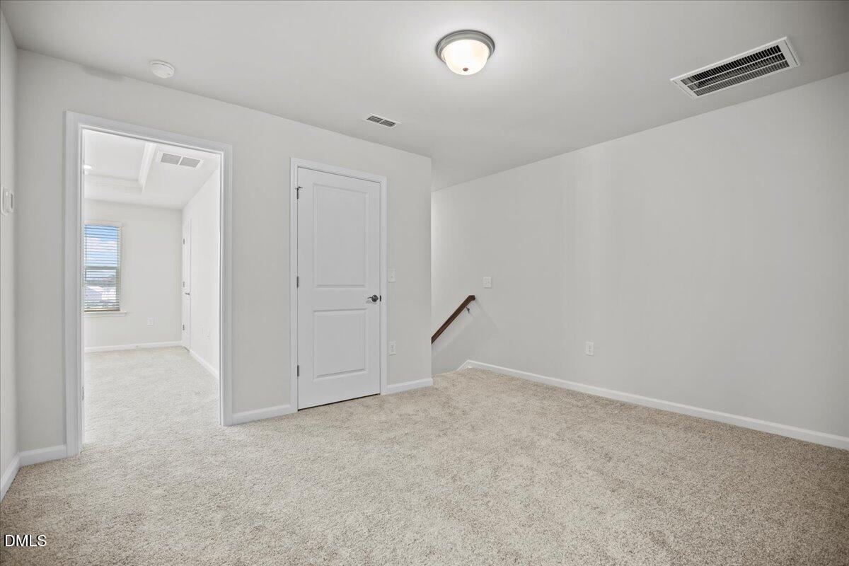 373 Fosterton Cottage Way Raleigh, NC 27603 - Photo 19 of 42 an empty room with an entryway