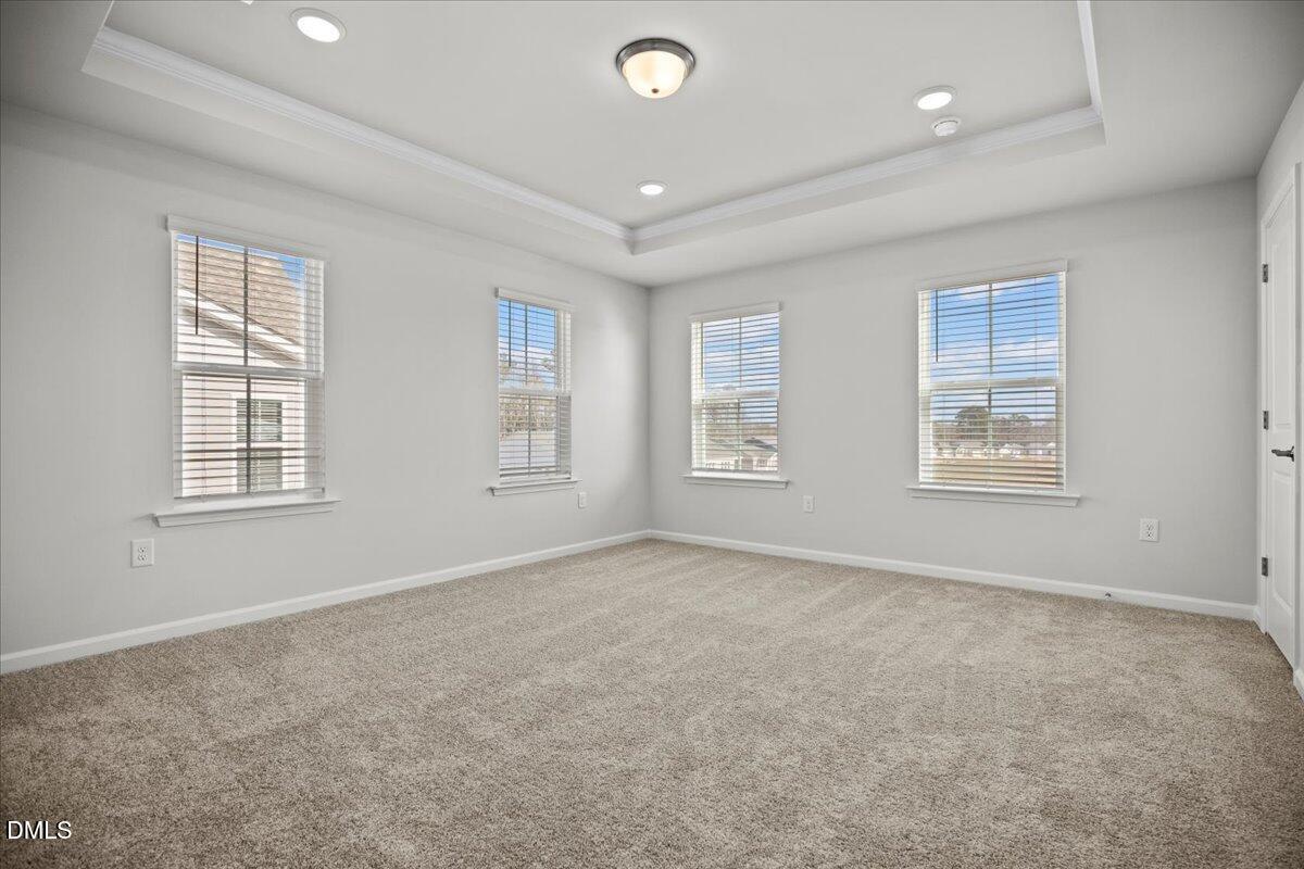 373 Fosterton Cottage Way Raleigh, NC 27603 - Photo 20 of 42 an empty room with windows