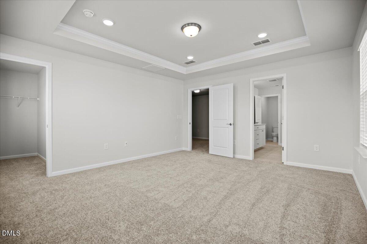373 Fosterton Cottage Way Raleigh, NC 27603 - Photo 21 of 42 an empty room with an entryway