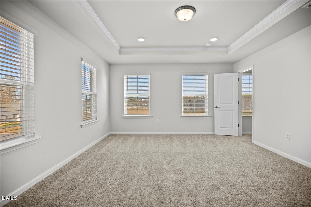 373 Fosterton Cottage Way Raleigh, NC 27603 - Photo 22 of 42 an empty room with windows and closet