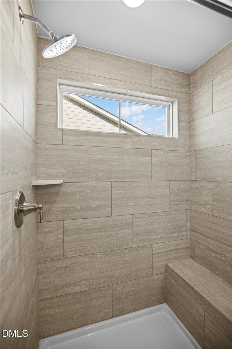 373 Fosterton Cottage Way Raleigh, NC 27603 - Photo 25 of 42 a bathroom with a shower