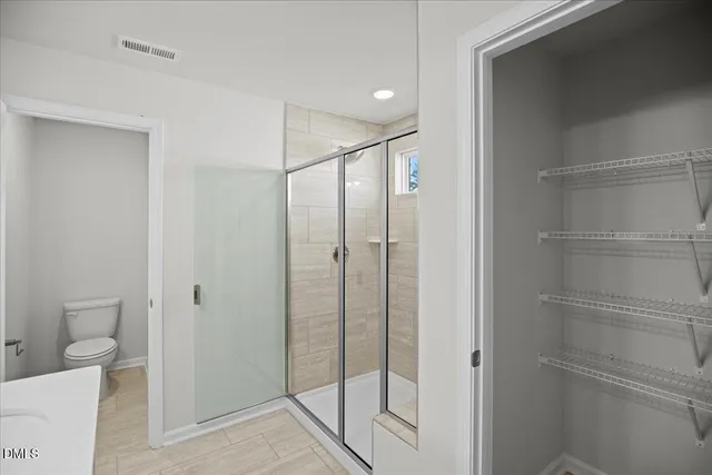 a bathroom with a sink double vanity and a mirror