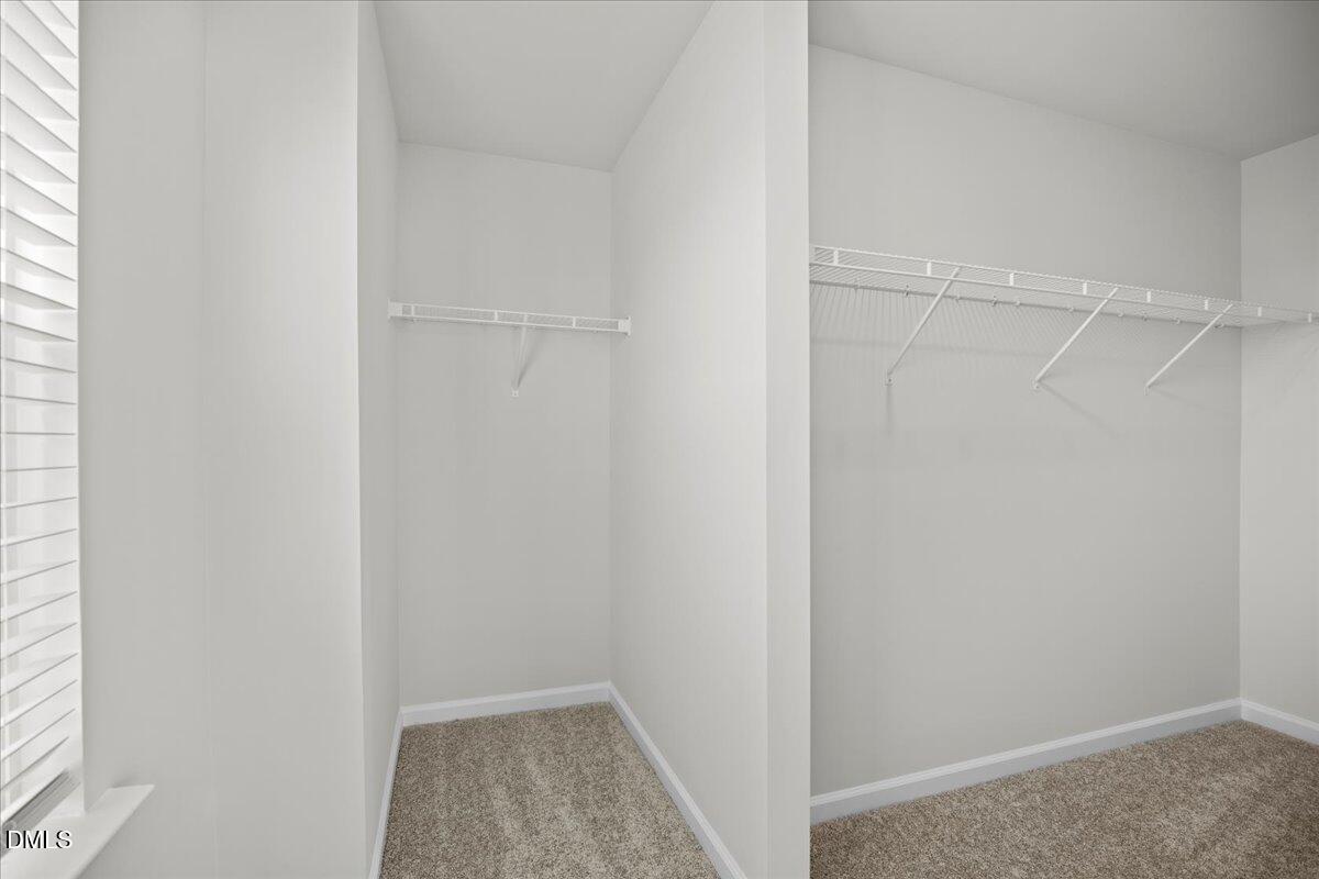 373 Fosterton Cottage Way Raleigh, NC 27603 - Photo 27 of 42 a view of a room with racks on the wall