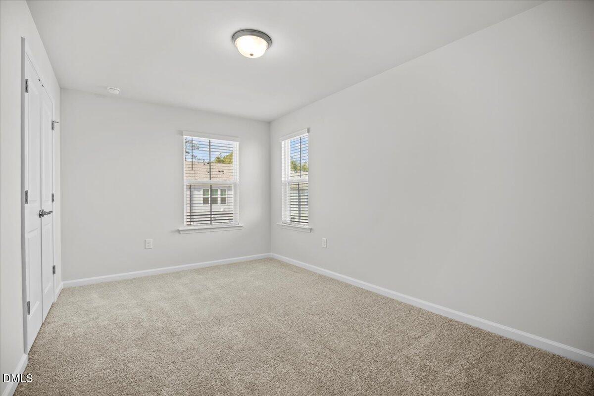 373 Fosterton Cottage Way Raleigh, NC 27603 - Photo 30 of 42 an empty room with windows