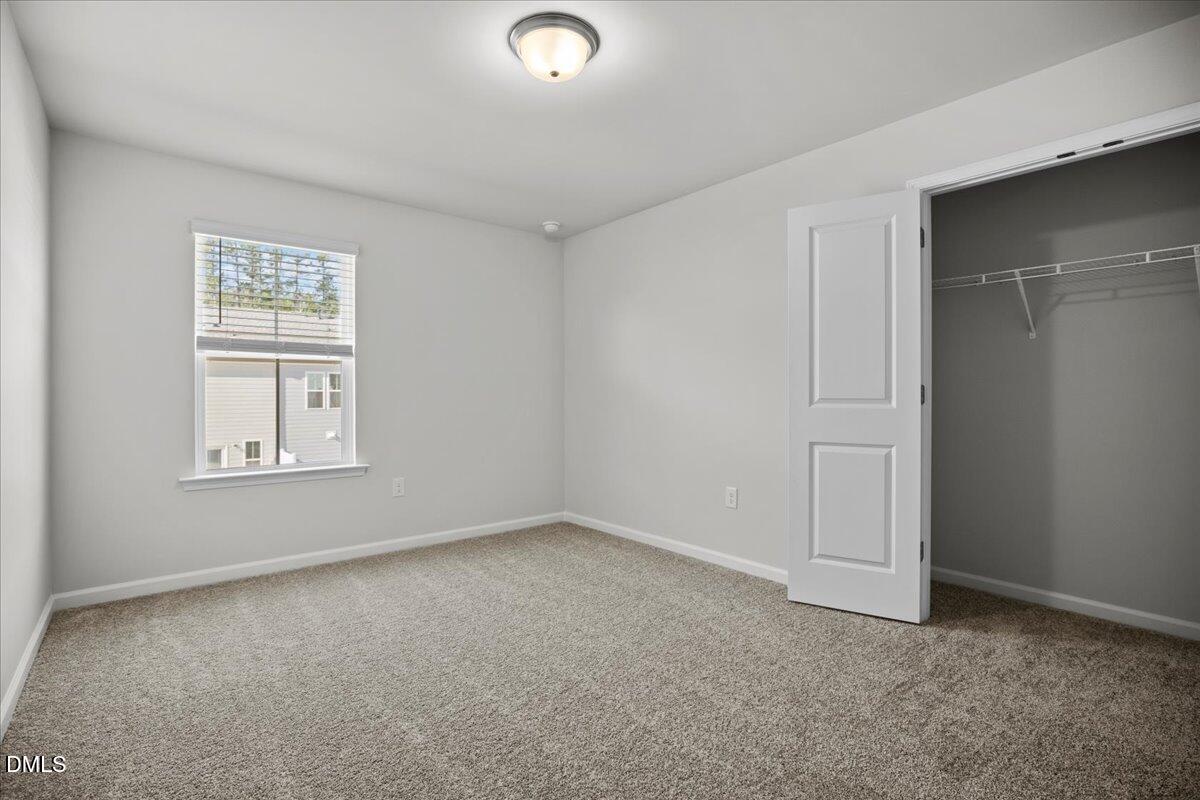 373 Fosterton Cottage Way Raleigh, NC 27603 - Photo 33 of 42 an empty room with windows