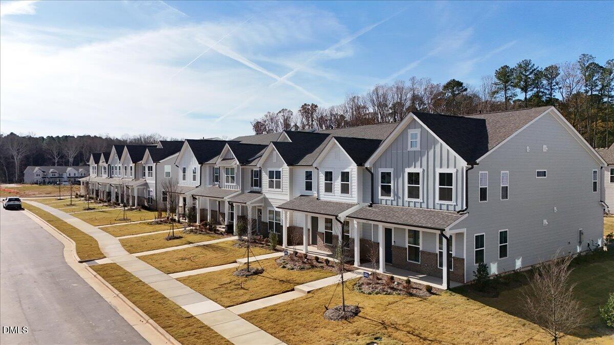 373 Fosterton Cottage Way Raleigh, NC 27603 - Photo 36 of 42 a view of a white house with a swimming pool
