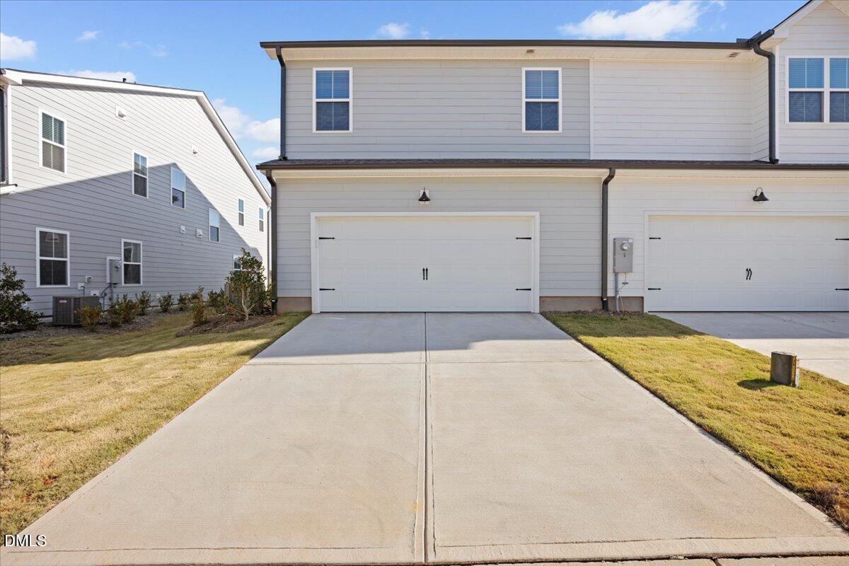 373 Fosterton Cottage Way Raleigh, NC 27603 - Photo 4 of 42 a view of a house with a backyard