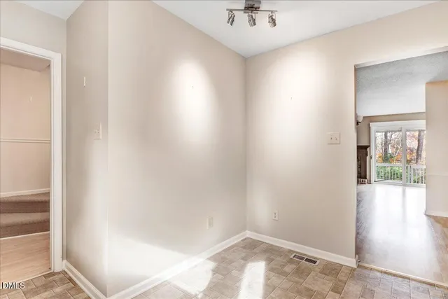 a kitchen with cabinets appliances and a window