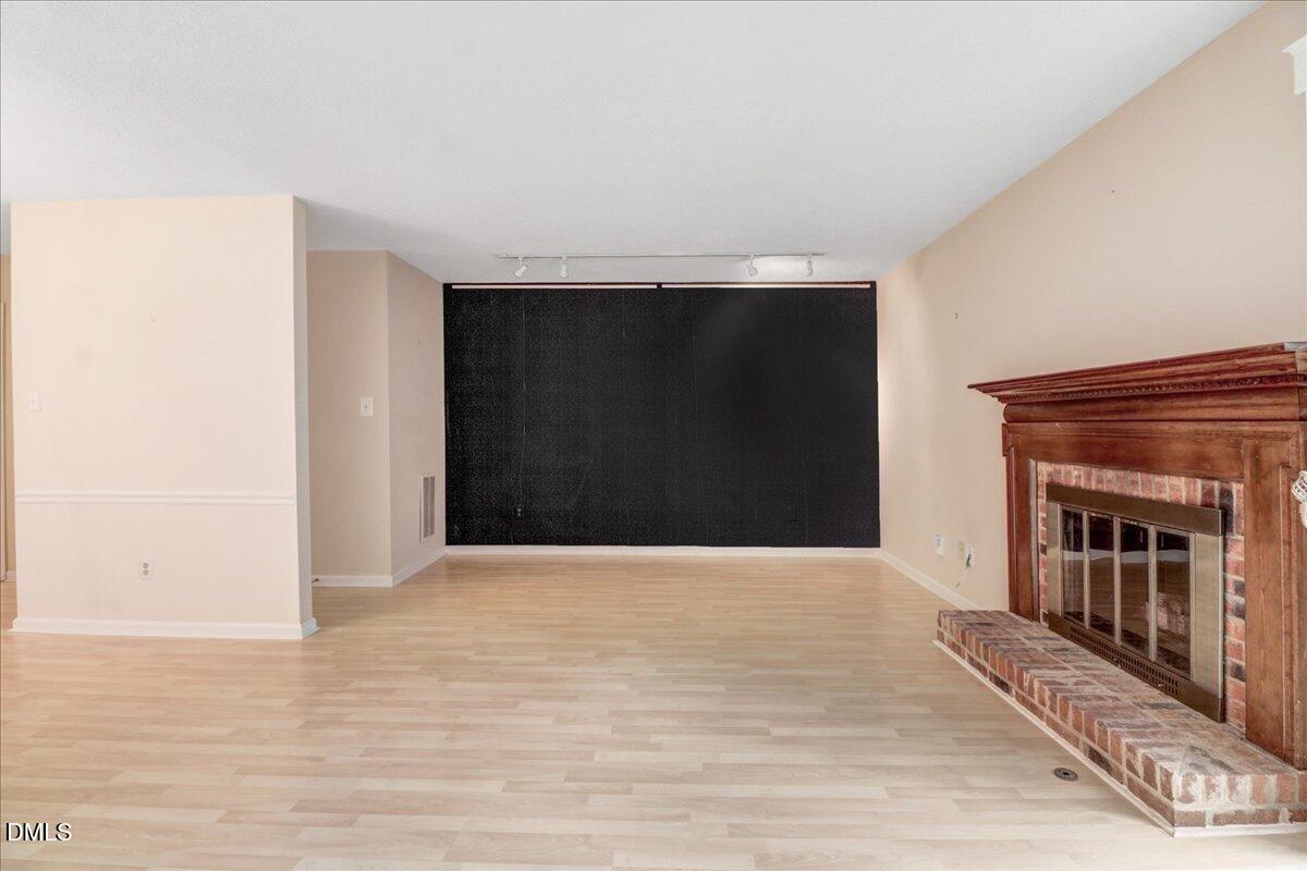 5738 3 Oaks Drive Raleigh, NC 27612 - Photo 16 of 32 a view of an empty room