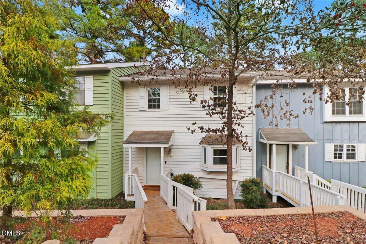 5738 3 Oaks Drive Raleigh, NC 27612 - Photo 2 of 32 front view of a house with a tree