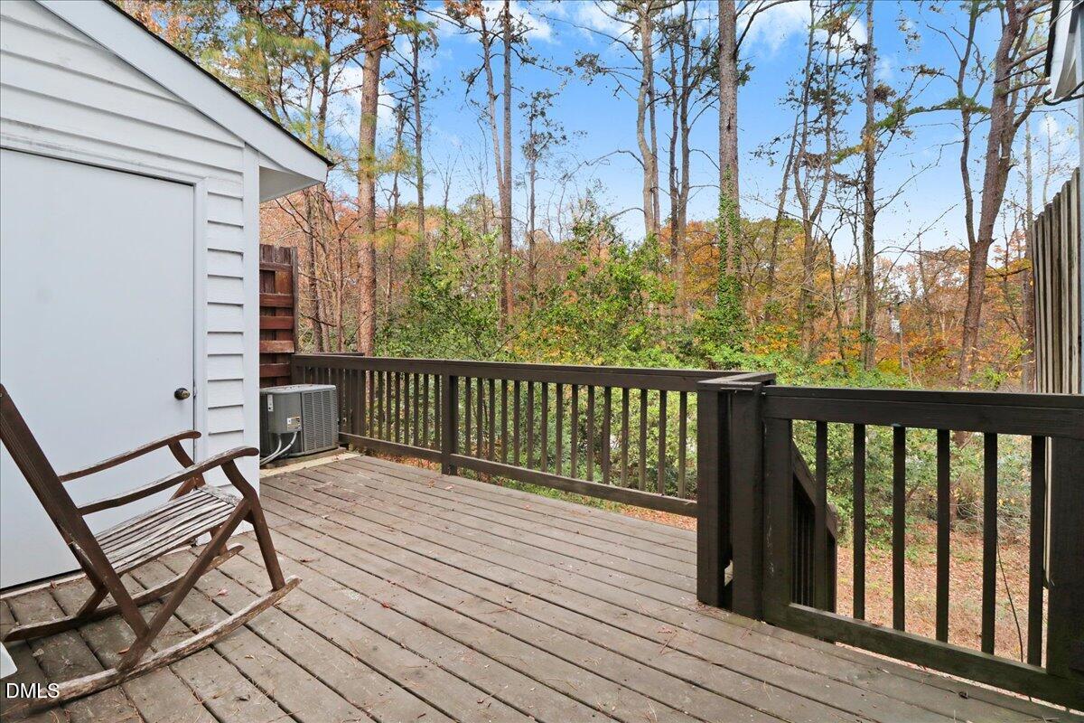5738 3 Oaks Drive Raleigh, NC 27612 - Photo 31 of 32 a view of balcony with wooden floor and fence