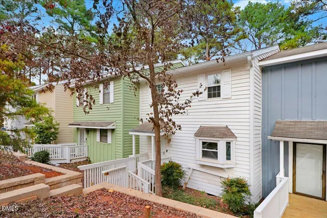 front view of a house with a tree