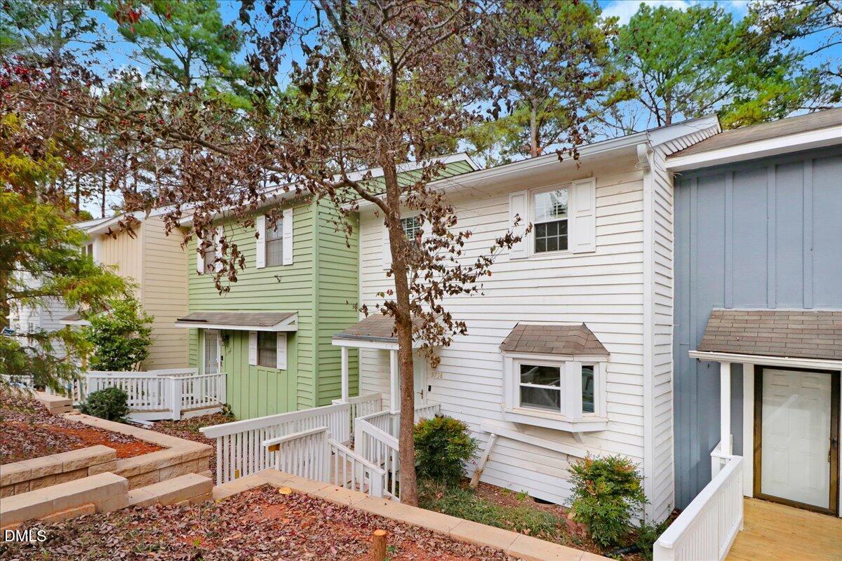 5738 3 Oaks Drive Raleigh, NC 27612 - Photo 3 of 32 a front view of a house with plants and trees