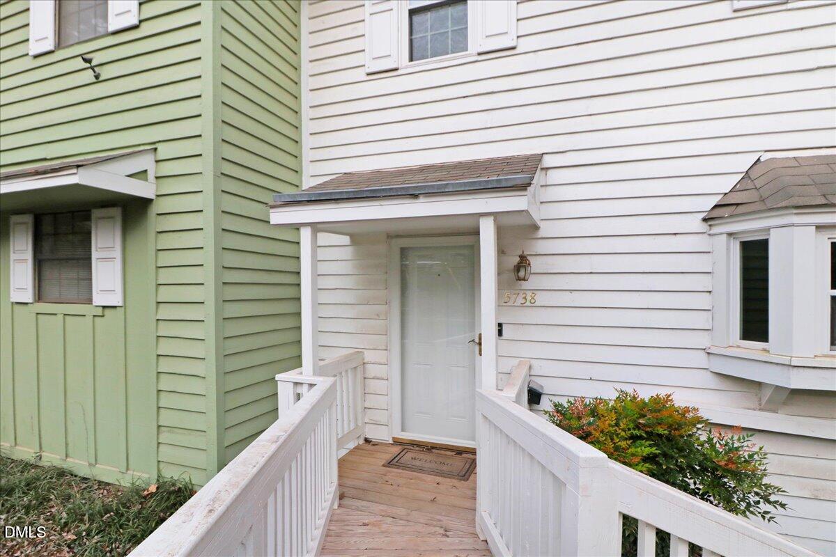5738 3 Oaks Drive Raleigh, NC 27612 - Photo 4 of 32 a view of a balcony and a large window