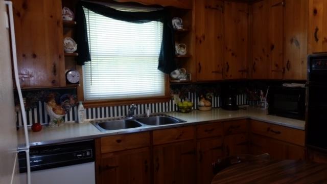 471 Old Alexandria Road Watertown, TN 37184 - Photo 8 of 15 Kitchen with window and beautiful knotty pine cabinets.