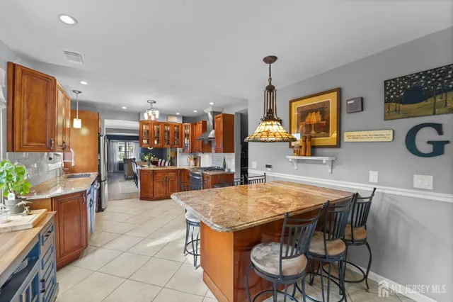 a kitchen with a table and chairs in it