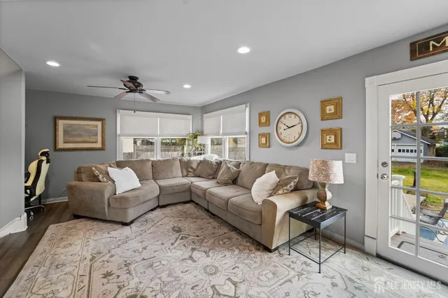 a living room with furniture and a table