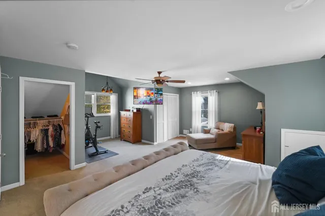 a bedroom with a bed and cabinets