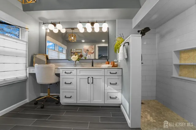 a kitchen with a sink cabinets and appliances