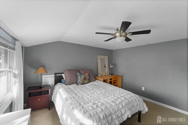 a bedroom with bed and window