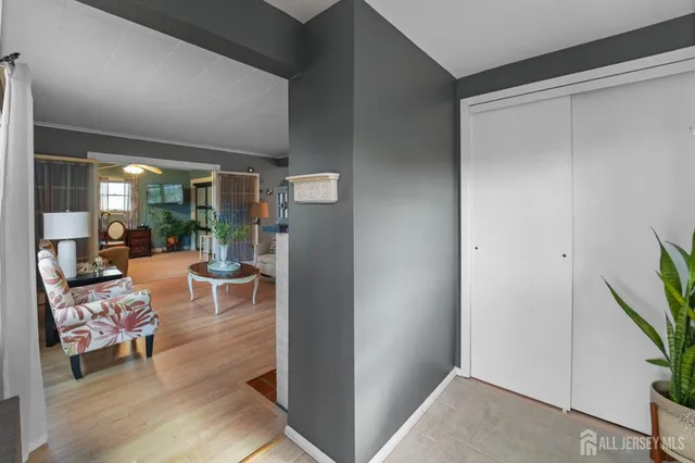 a view of a livingroom with furniture and a window
