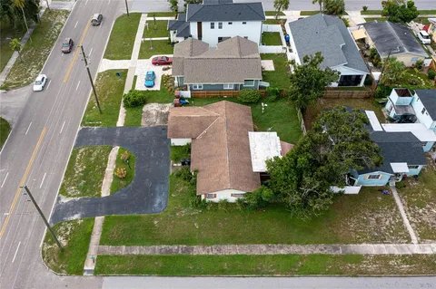 an aerial view of a house with outdoor space