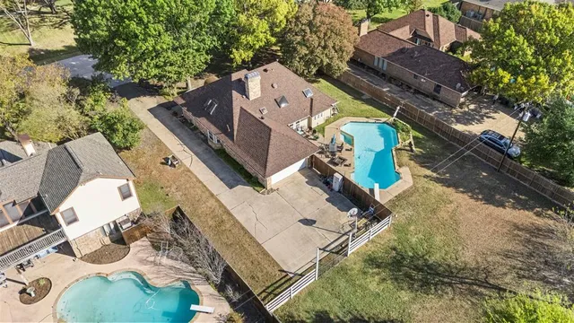 an aerial view of a house with outdoor space