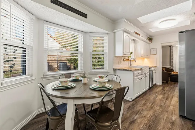 a view of a dining room with furniture and windows