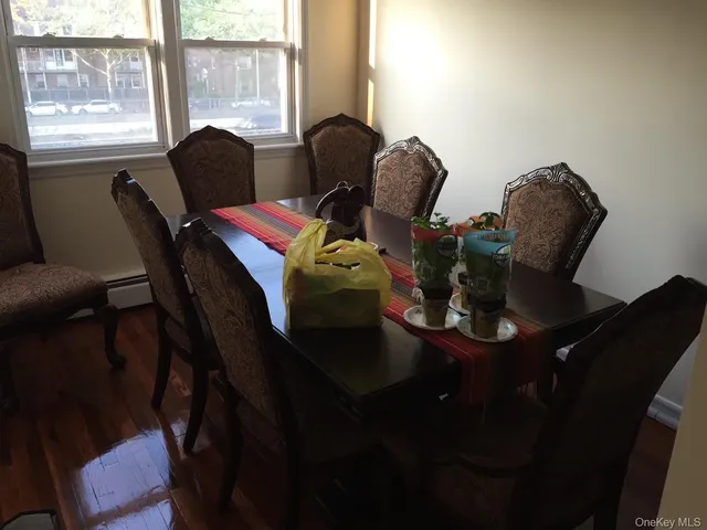 a dining room with furniture and window