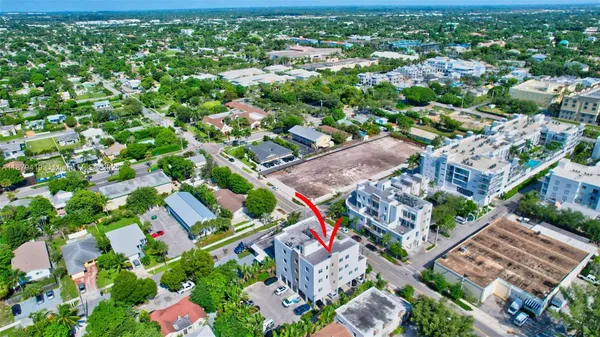 an aerial view of residential houses with outdoor space