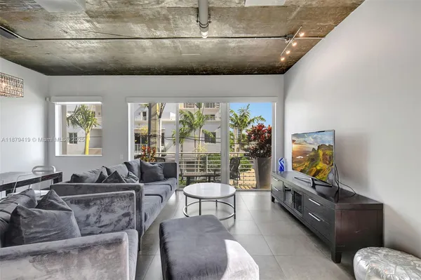 a living room with furniture and window