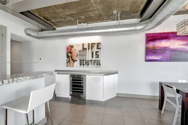 a view of kitchen with a sink and dishwasher in a kitchen