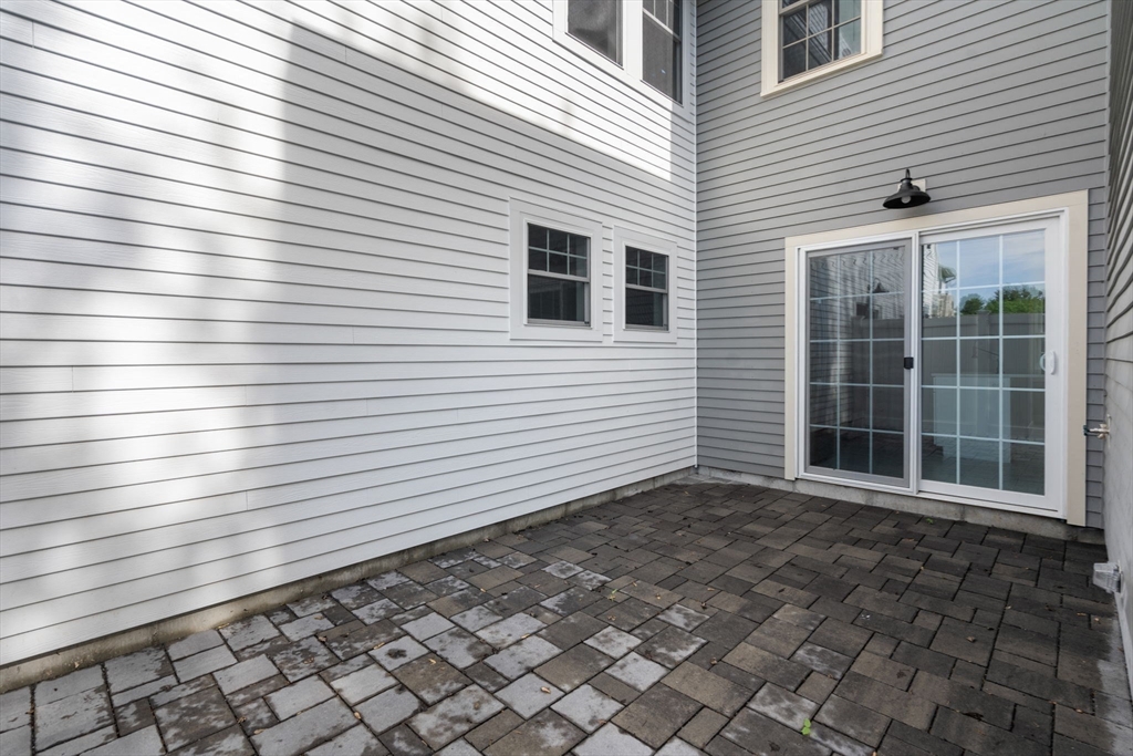 97 Bacon Street, Unit B Natick, MA 01760 - Photo 20 of 37 a view of a house with a door