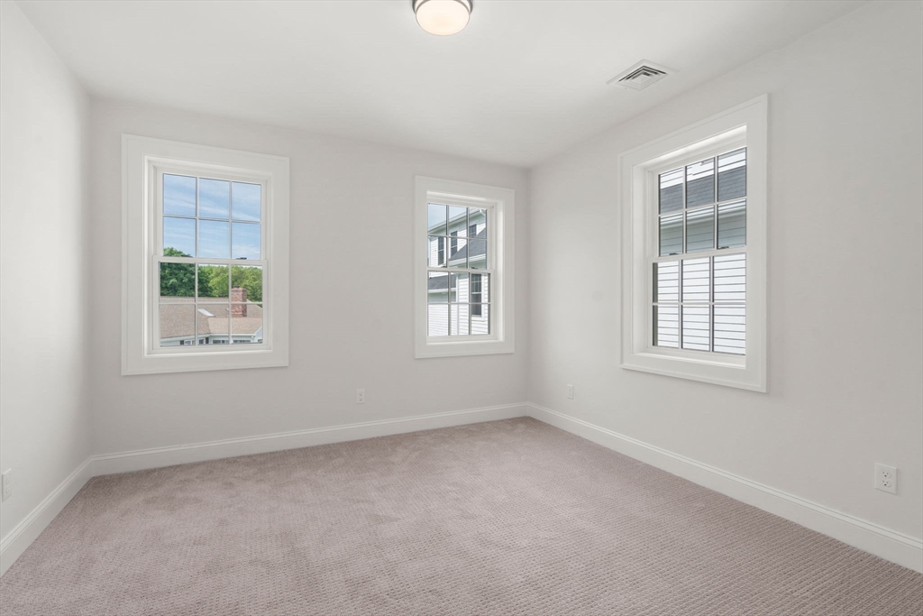 97 Bacon Street, Unit B Natick, MA 01760 - Photo 29 of 37 a view of an empty room with a window