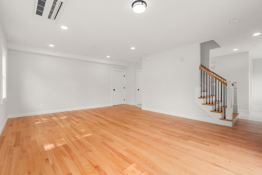 97 Bacon Street, Unit B Natick, MA 01760 - Photo 9 of 37 a view of empty room with wooden floor