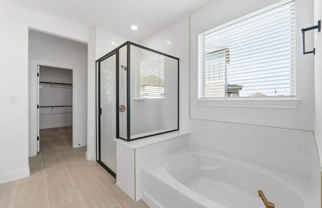 a view of a hallway with a ceiling fan