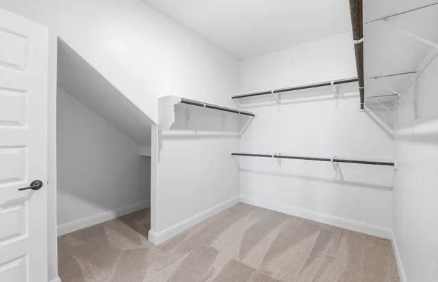 a bathroom with a sink a mirror and a shower