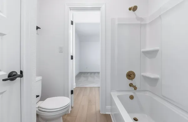 a bathroom with a sink a mirror and a shower