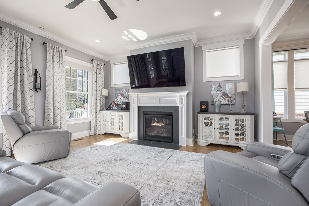 960 Cheltenham Avenue Franklin, TN 37064 - Photo 11 of 62 a living room with furniture a flat screen tv and a fireplace