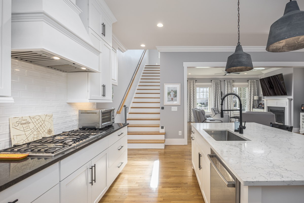 960 Cheltenham Avenue Franklin, TN 37064 - Photo 20 of 62 a kitchen with granite countertop a sink stainless steel appliances and cabinets