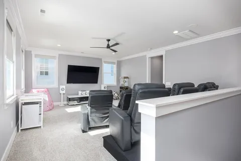 a view of residential houses with yard and green space