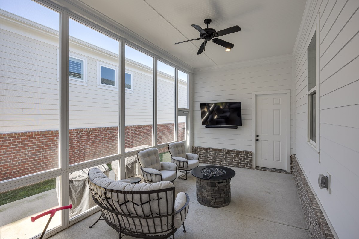 960 Cheltenham Avenue Franklin, TN 37064 - Photo 39 of 62 a living room with furniture a flat screen tv and a large window