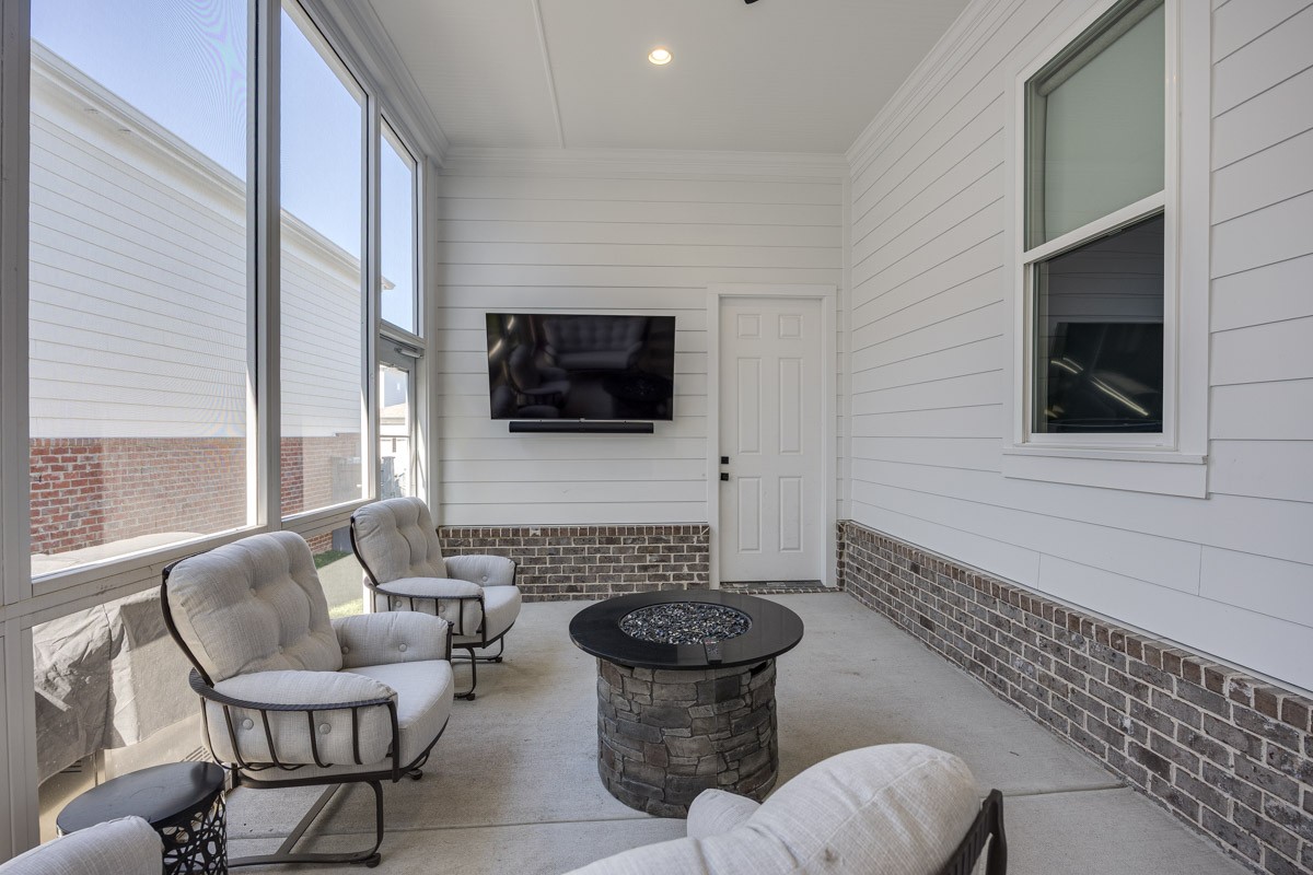 960 Cheltenham Avenue Franklin, TN 37064 - Photo 40 of 62 a living room with furniture a flat screen tv and a large window